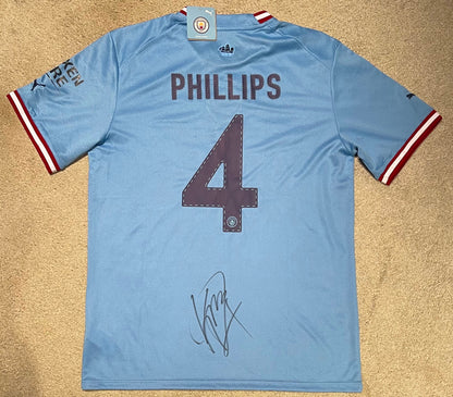 KALVIN PHILLIPS HAND SIGNED FRAMED MANCHESTER CITY SHIRT