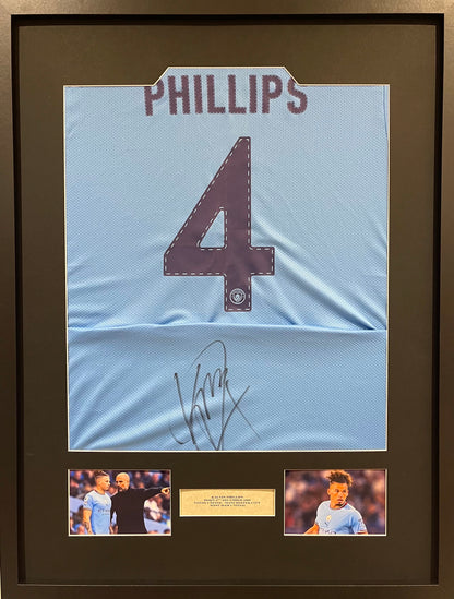 KALVIN PHILLIPS HAND SIGNED FRAMED MANCHESTER CITY SHIRT