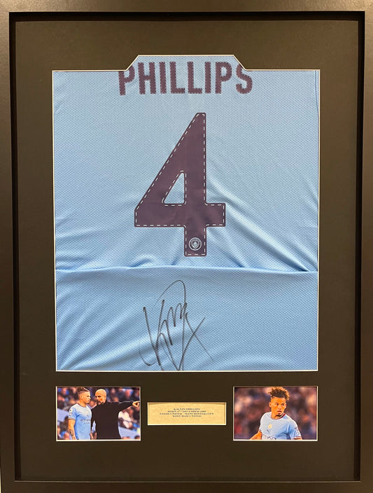 KALVIN PHILLIPS HAND SIGNED FRAMED MANCHESTER CITY SHIRT