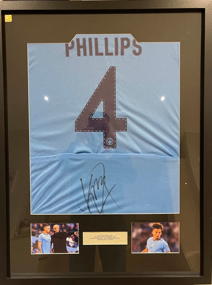 KALVIN PHILLIPS HAND SIGNED FRAMED MANCHESTER CITY SHIRT