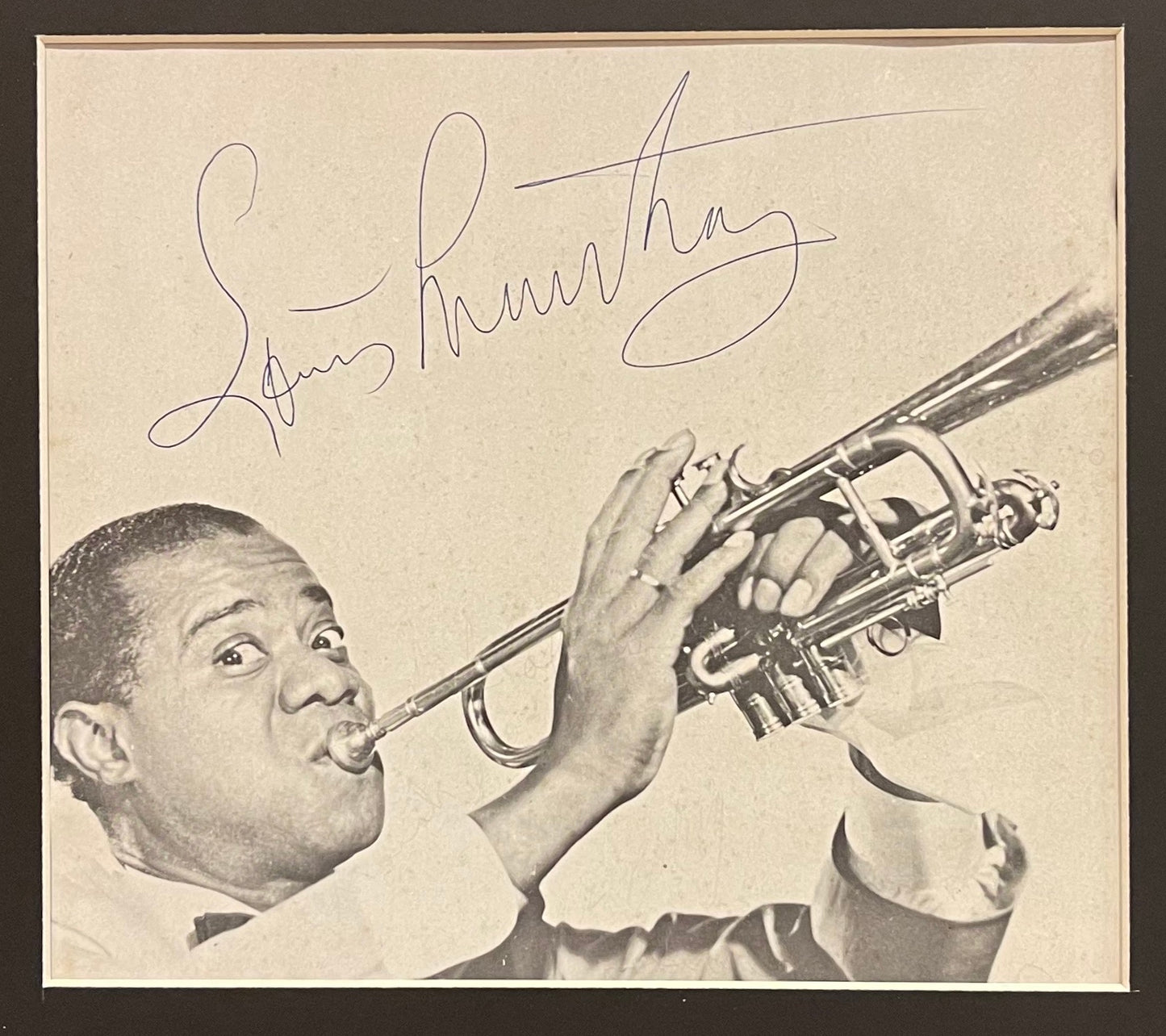 LOUIS ARMSTRONG HAND SIGNED MAGAZINE PAGE WITH COA