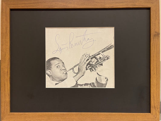 LOUIS ARMSTRONG HAND SIGNED MAGAZINE PAGE WITH COA