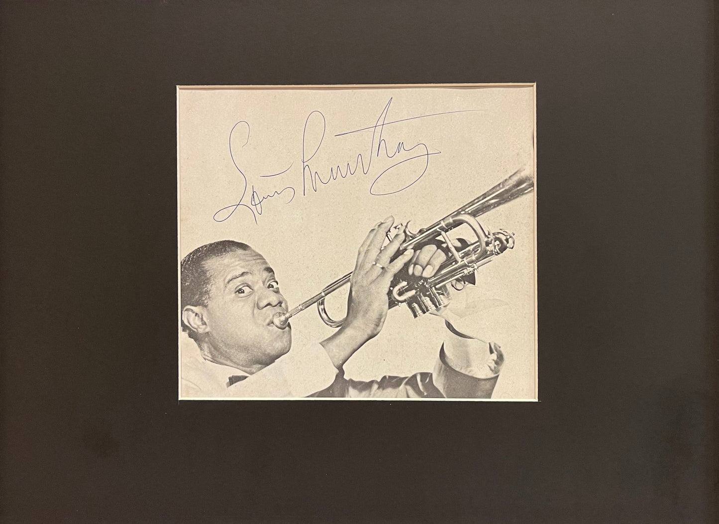 LOUIS ARMSTRONG HAND SIGNED MAGAZINE PAGE WITH COA