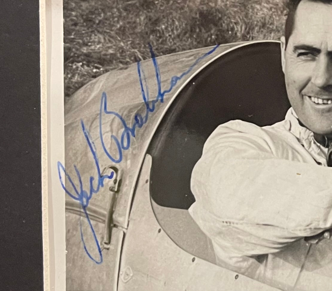 SIR JACK BRABHAM FORMULA 1 WORLD CHAMPION HAND SIGNED ORIGINAL PHOTO WITH COA